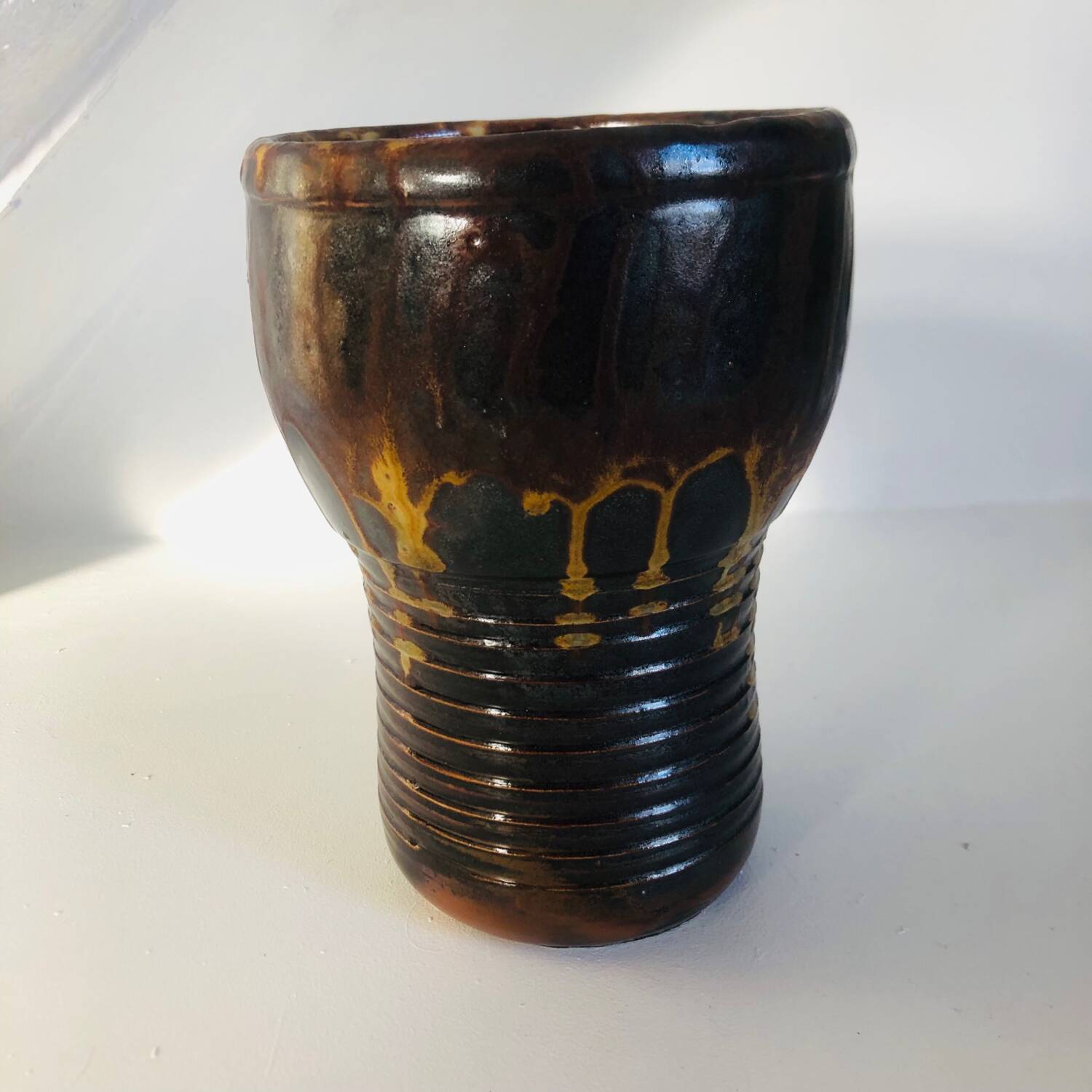 Metallic brown ceramic torso vase