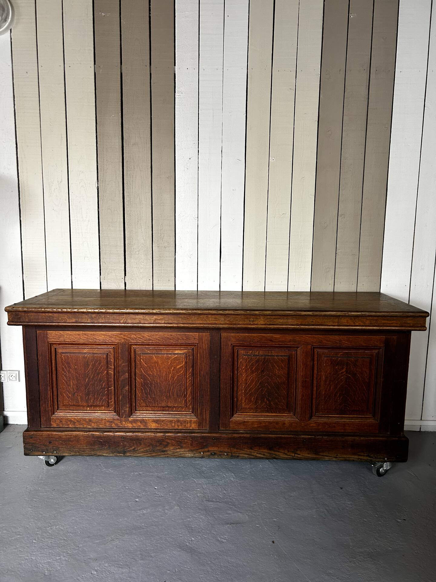 Large antique haberdashery counter in oak