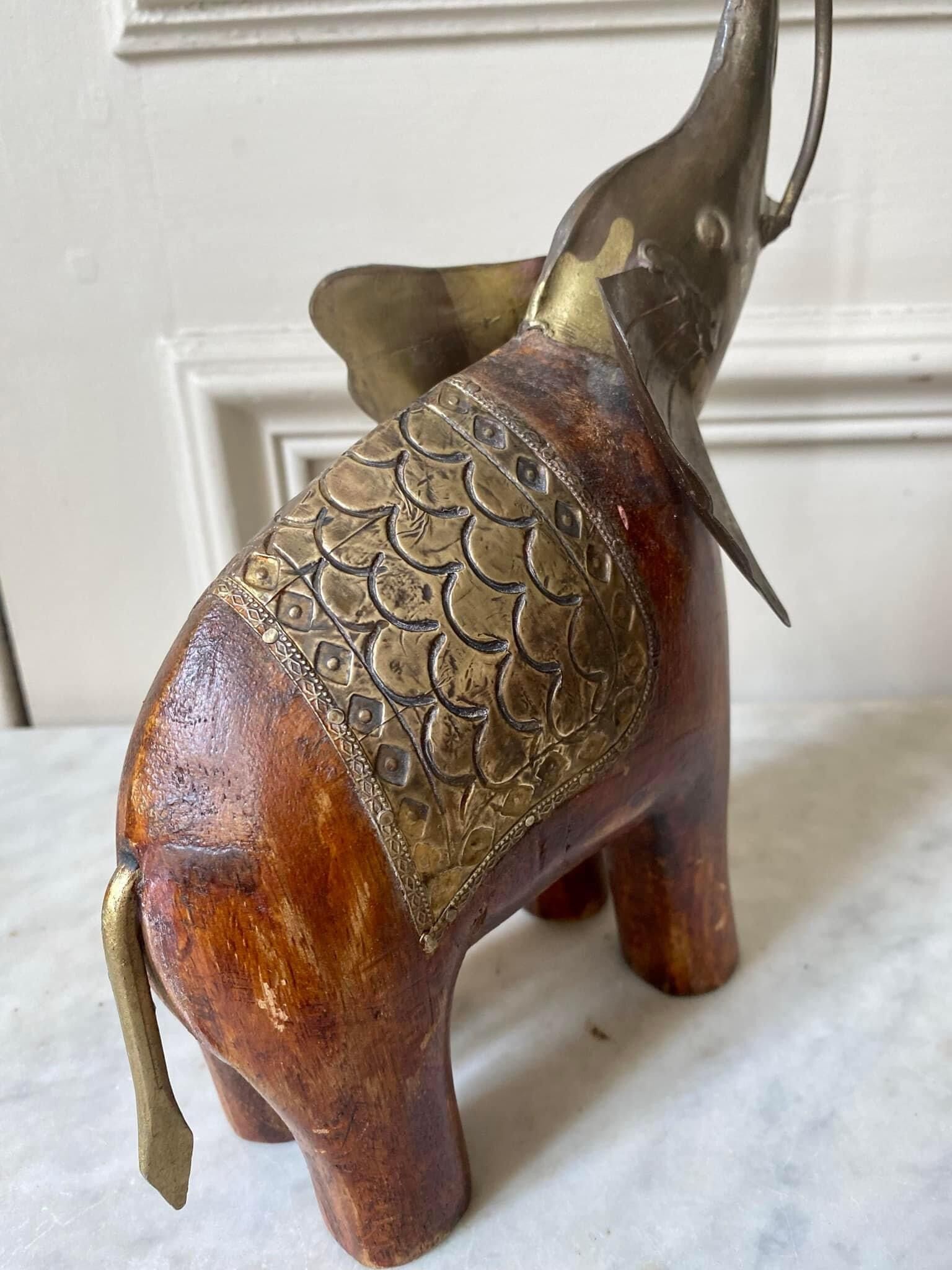 Wooden elephant and brass