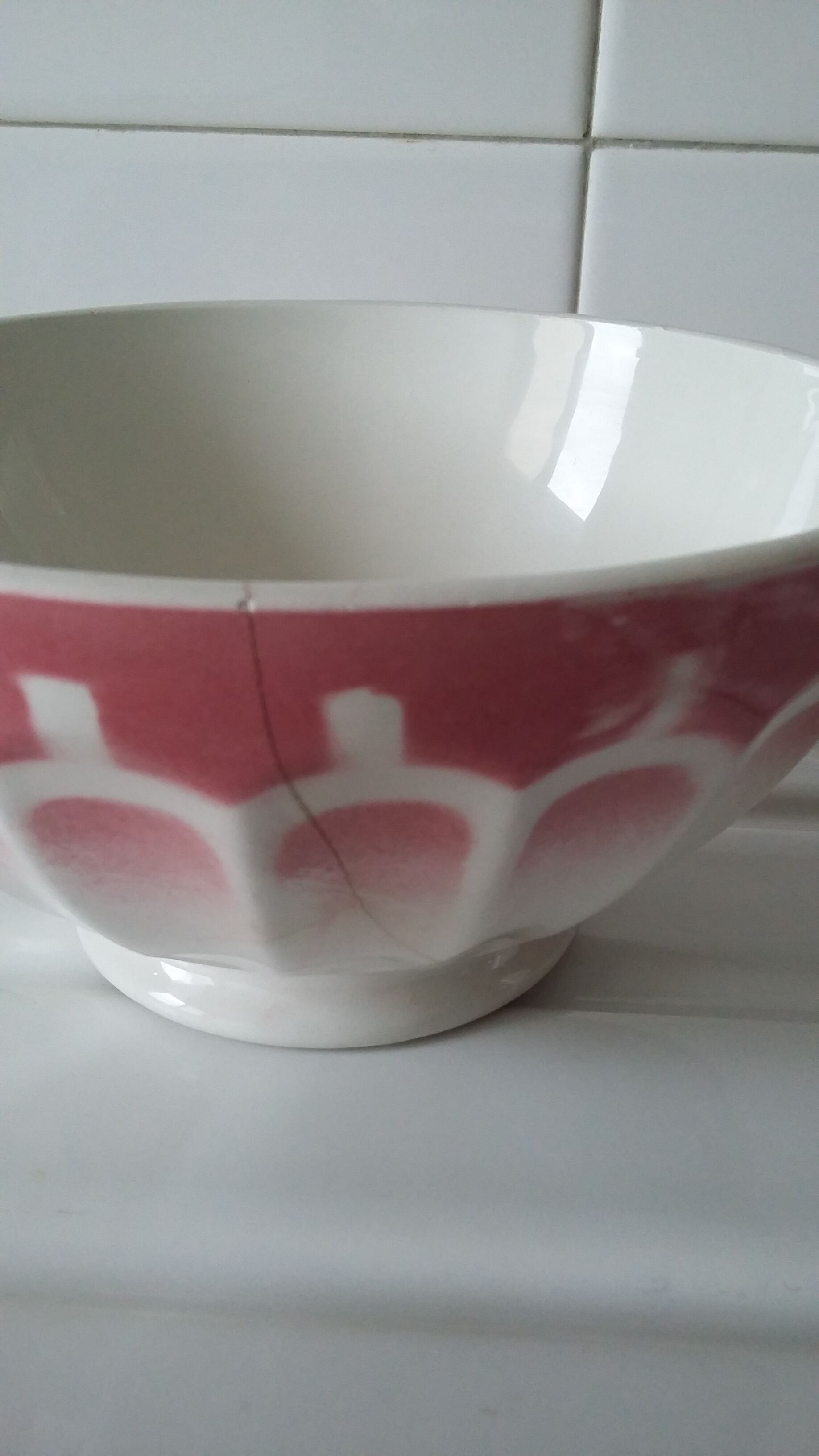 Ancient bowl in pink and white earthenware