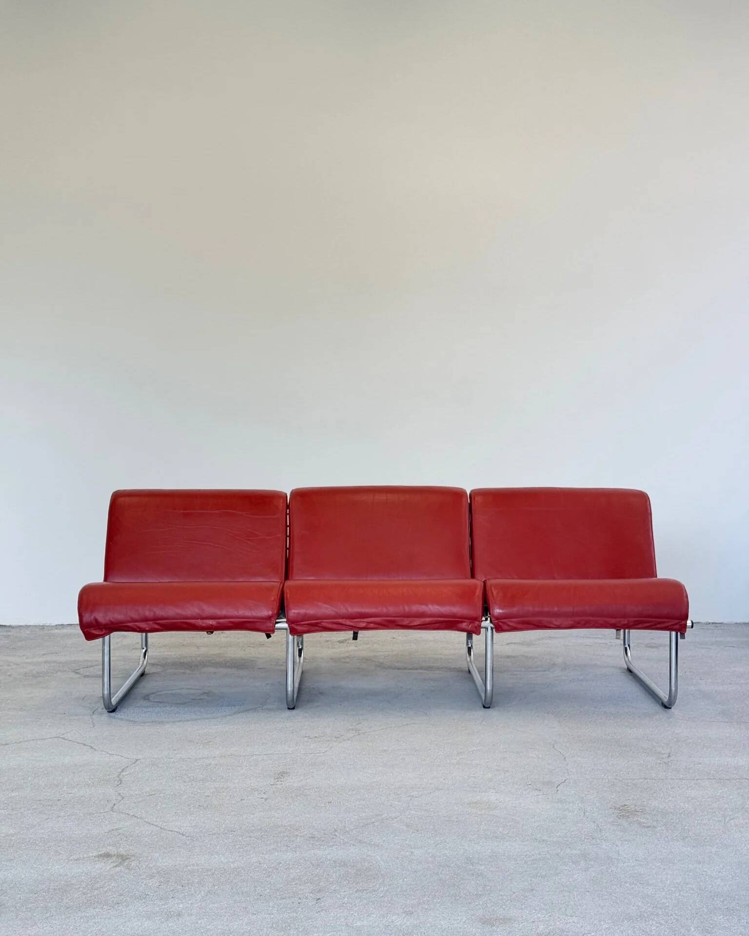 Red leather Remmi sofa by Yrjö Kukkapuro
