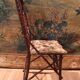 Folk art chair, black forest in branches