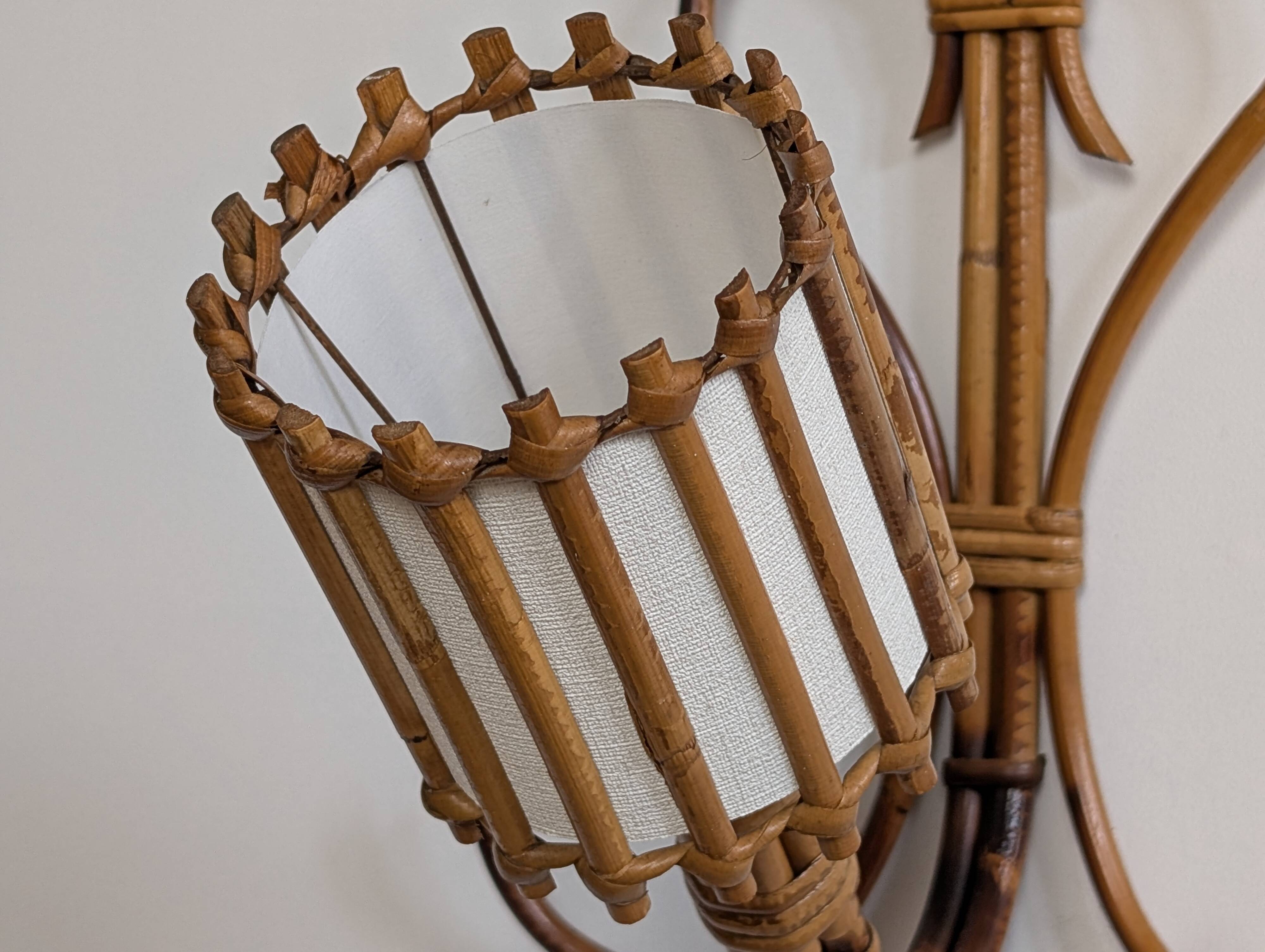 Rattan wall lights by Louis Sognot