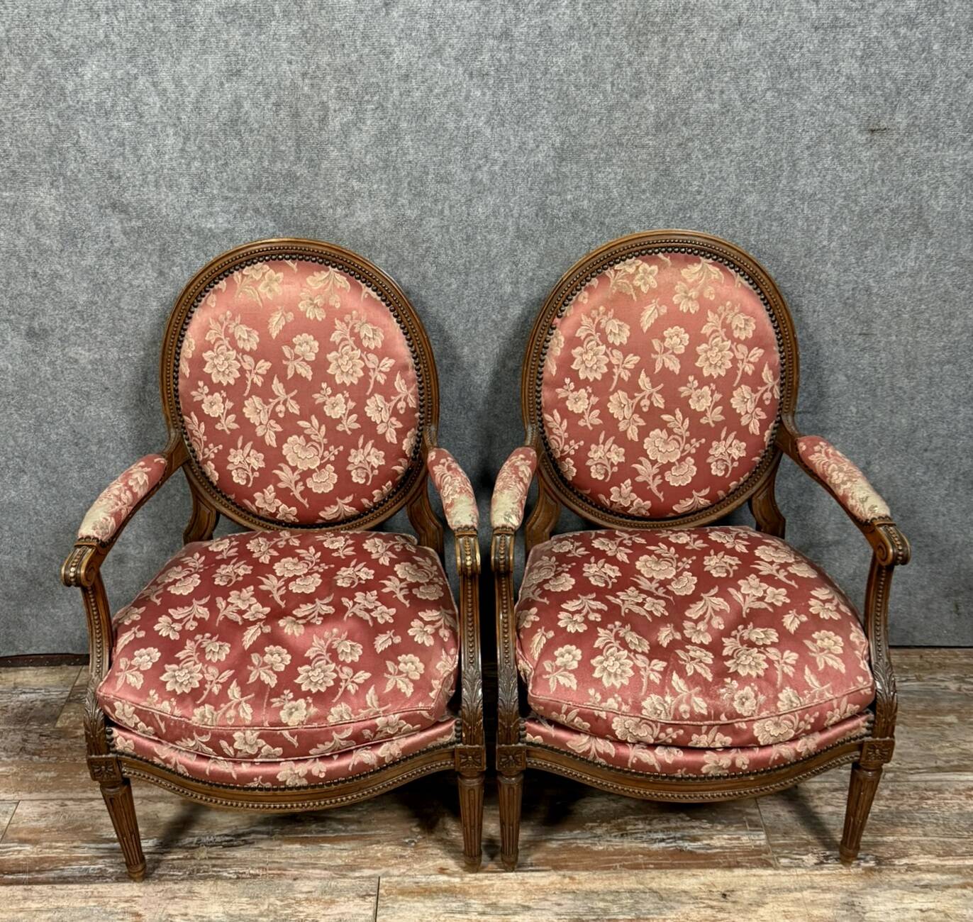 Pair of Louis XVI style armchairs in carved wood circa 1850