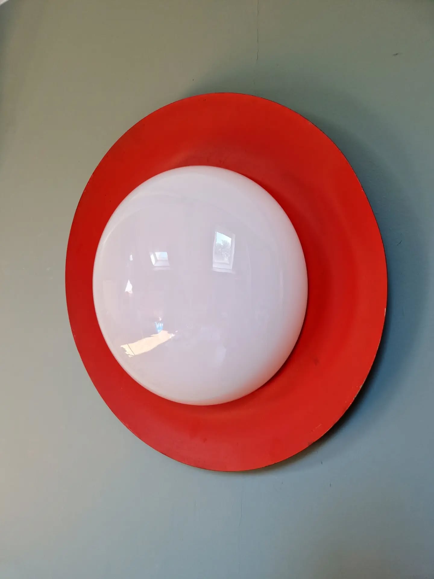 Pair of XXL Space Age wall sconces, orange lacquered metal and opaline, 1960.
