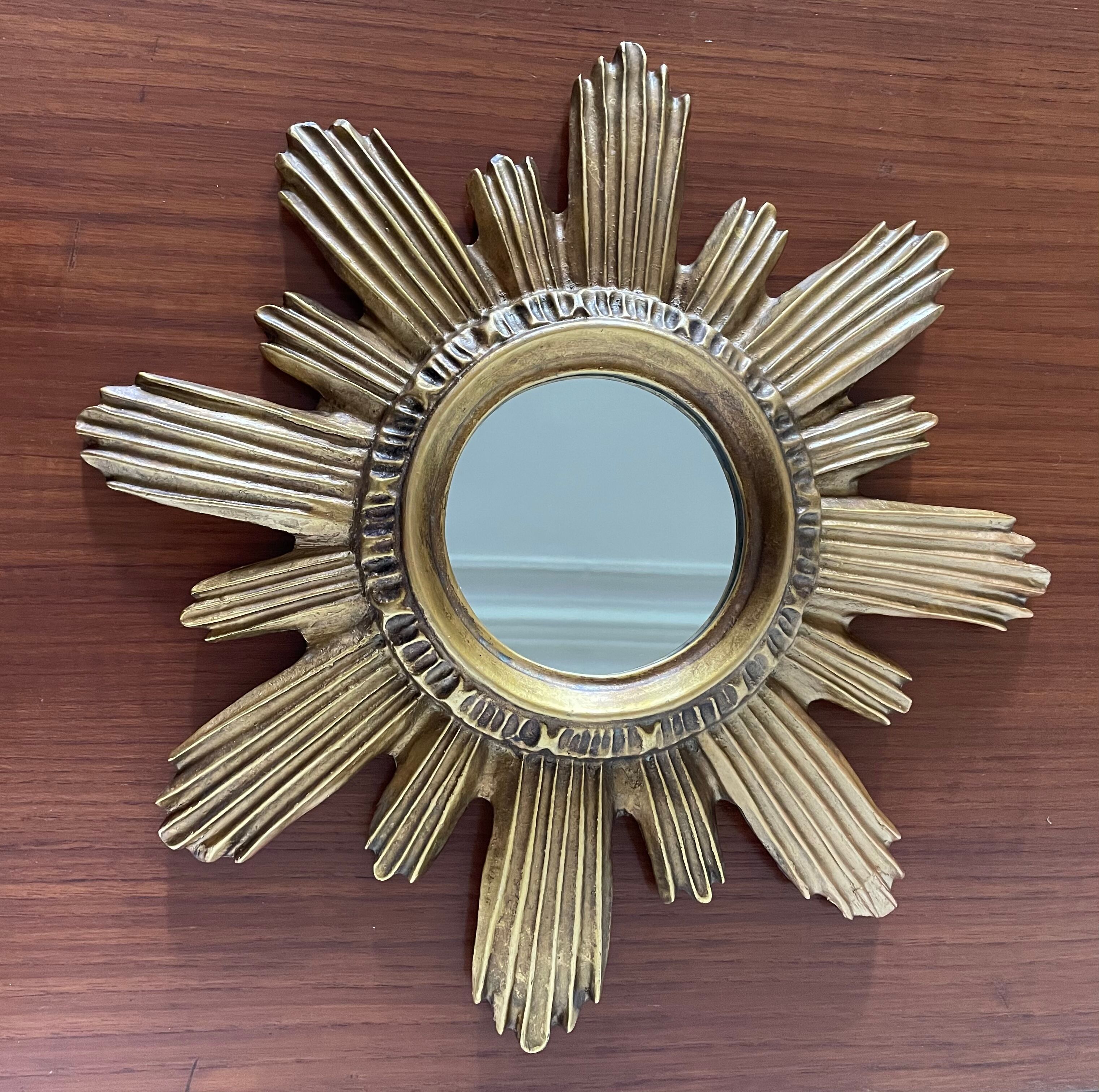 Vintage sun mirror in 60s/70s gold resin