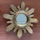 Vintage sun mirror in 60s/70s gold resin