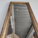 Long wooden mirror and gilded stucco with pearl rays H: 2m45 L: 40cm