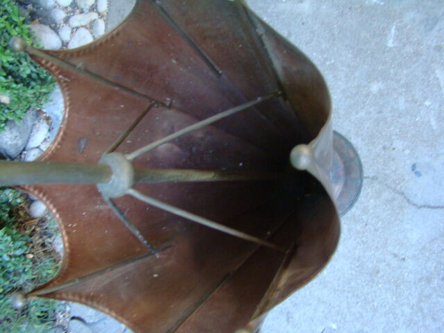 Old copper umbrella holder