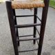 High bar stool in dark solid wood and straw 75cm