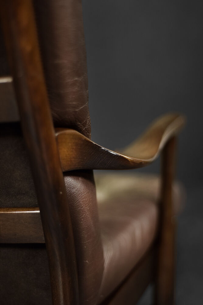 Modern vintage Danish armchair in beech and brown leather by Farstrup Møbler, 1970.
