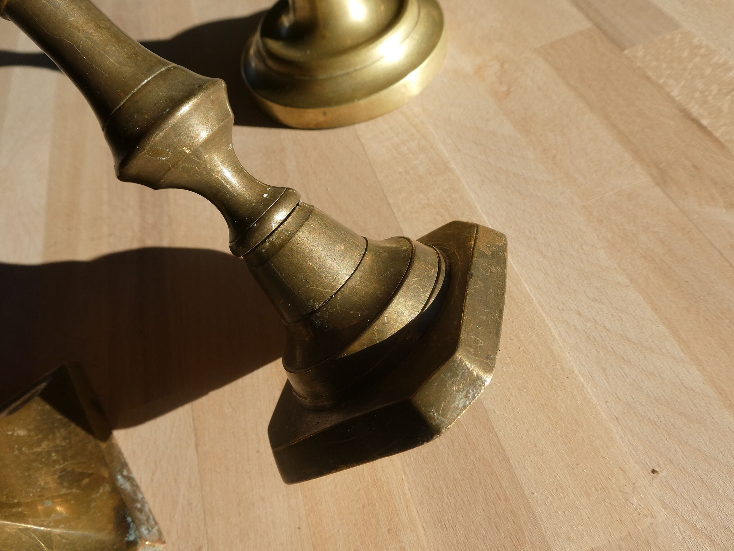 Set of 4 old candle holders in golden brass