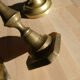 Set of 4 old candle holders in golden brass
