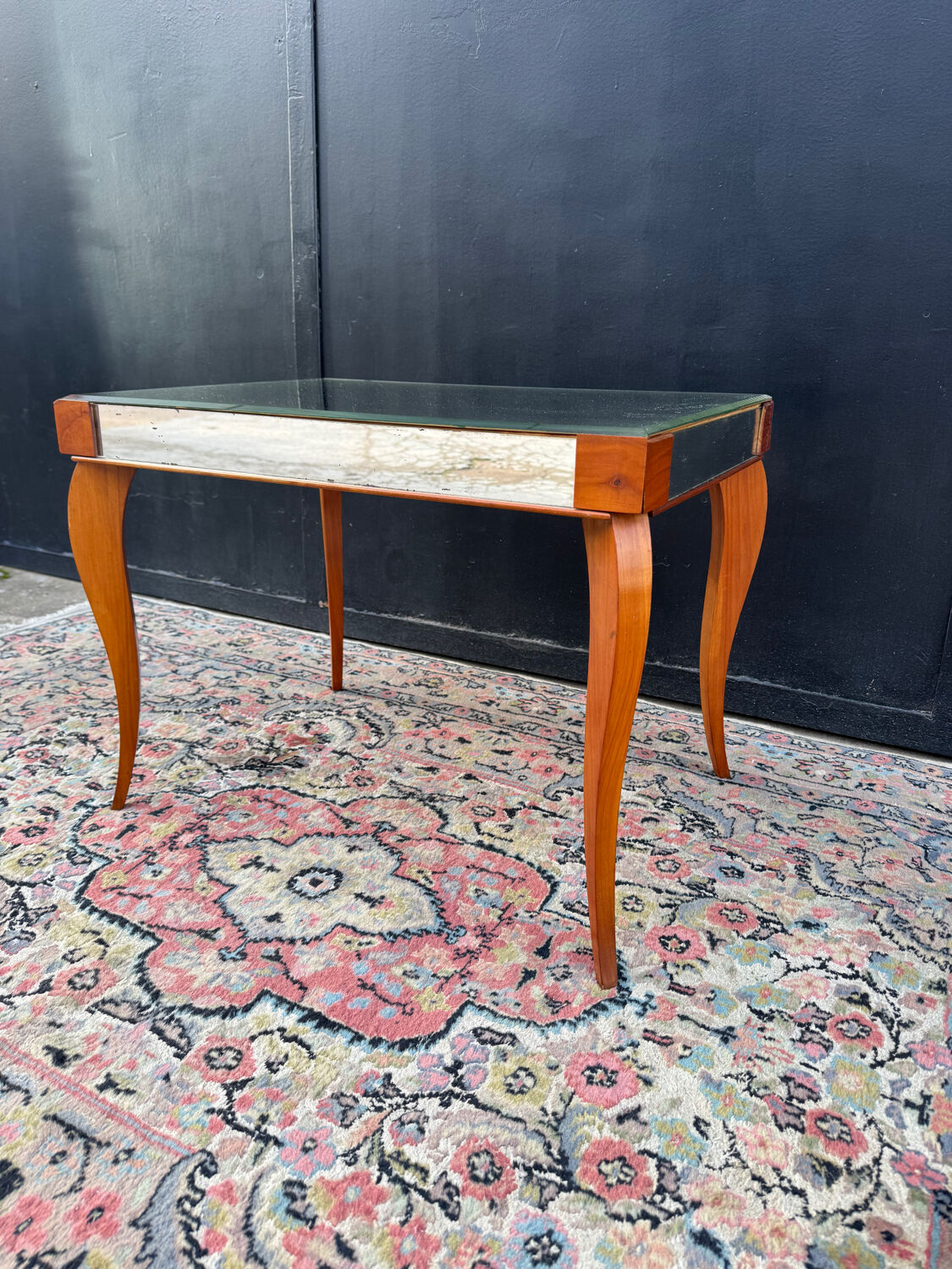 Small wooden coffee table with a mirror from the 1950s.