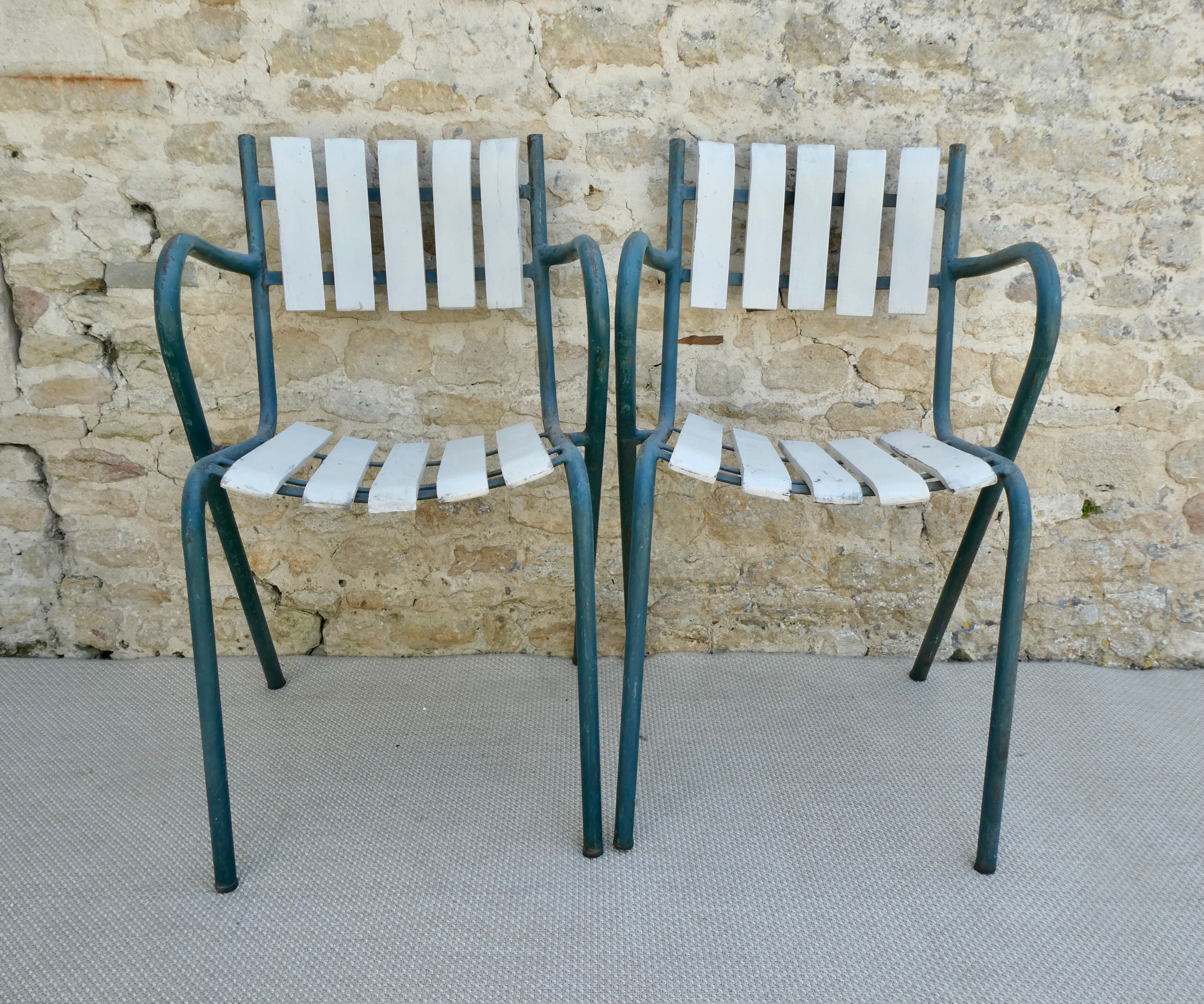 Pair of wooden and metal armchairs from the 60s