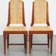 4 wooden Art Deco design dining chairs with a wicker seat and backrest
