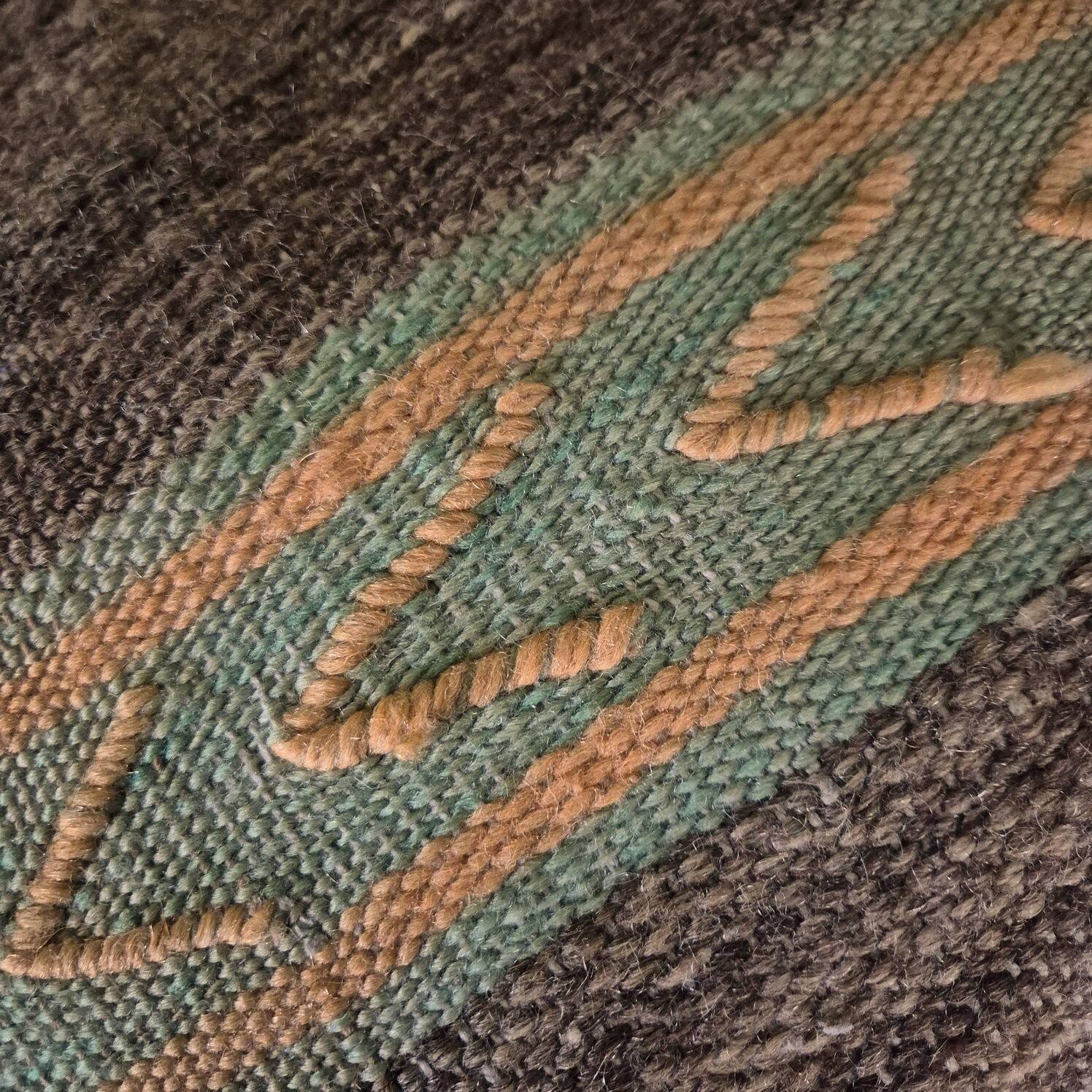 Cushion cover in old Berber blanket.