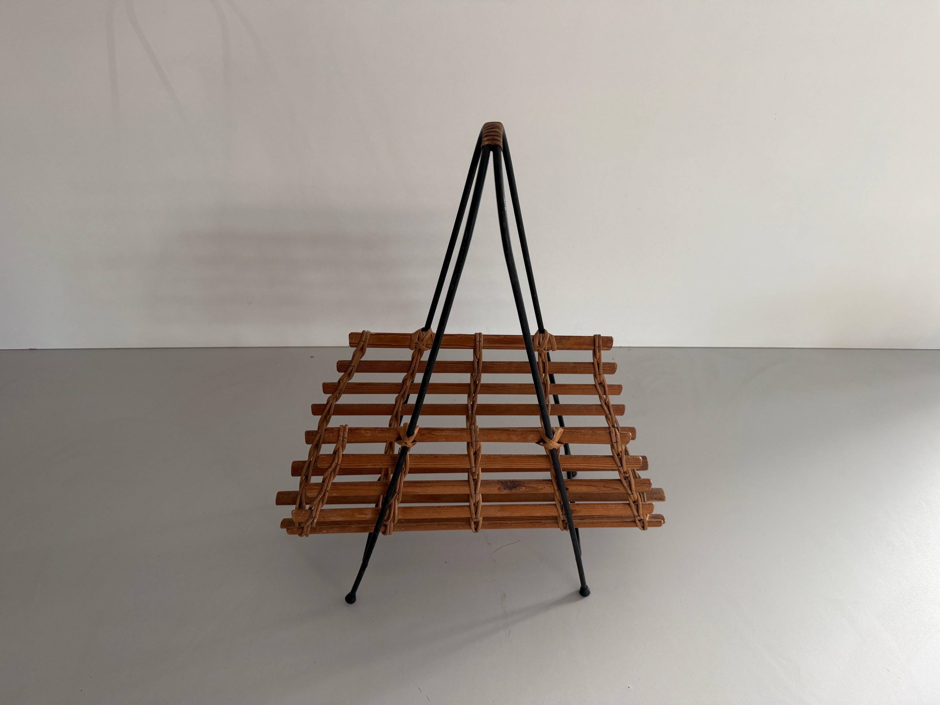 Mid-century black metal and wicker magazine rack, 1960, Germany