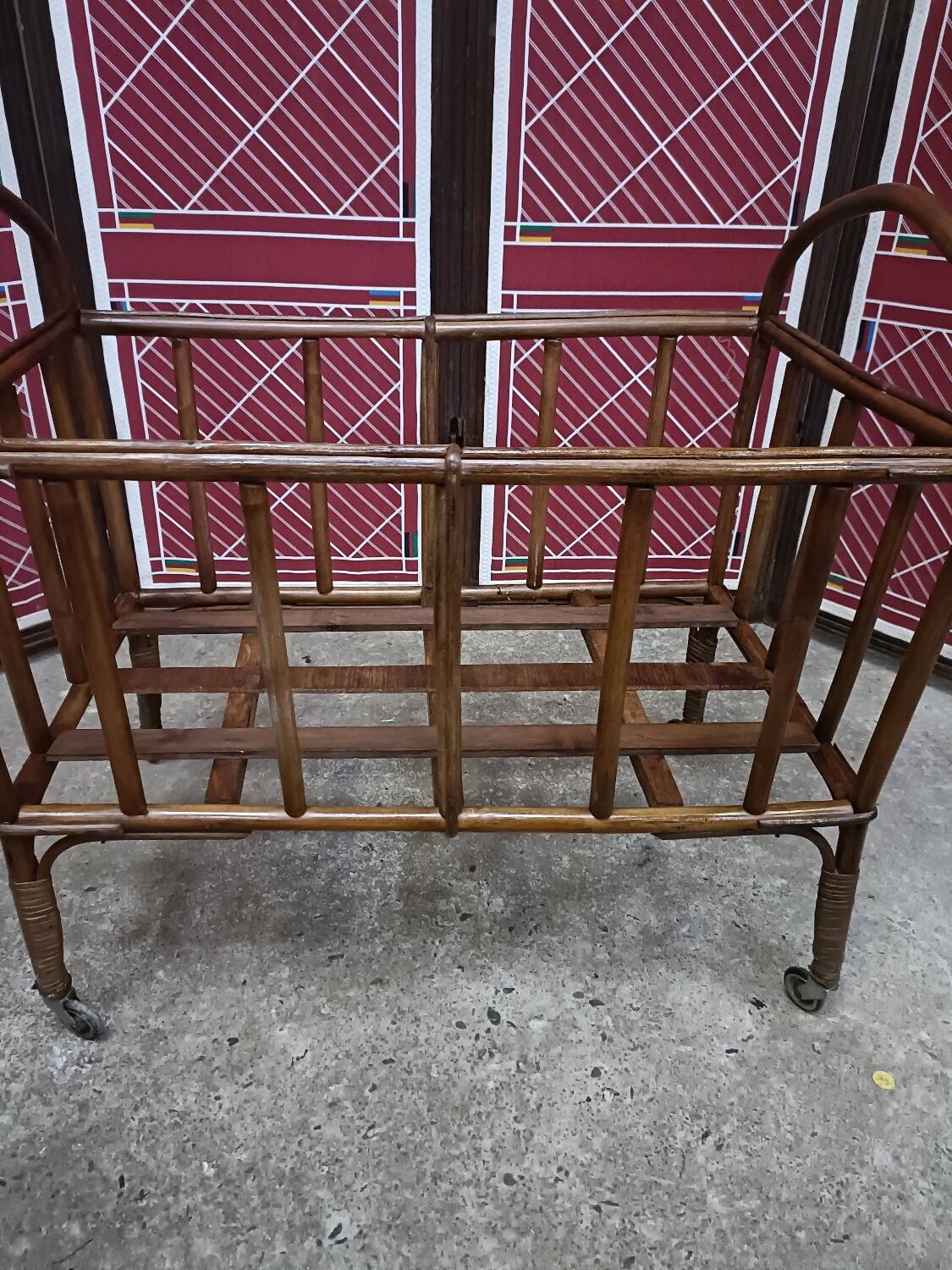 Old small bed or cradle for baby in vintage rattan