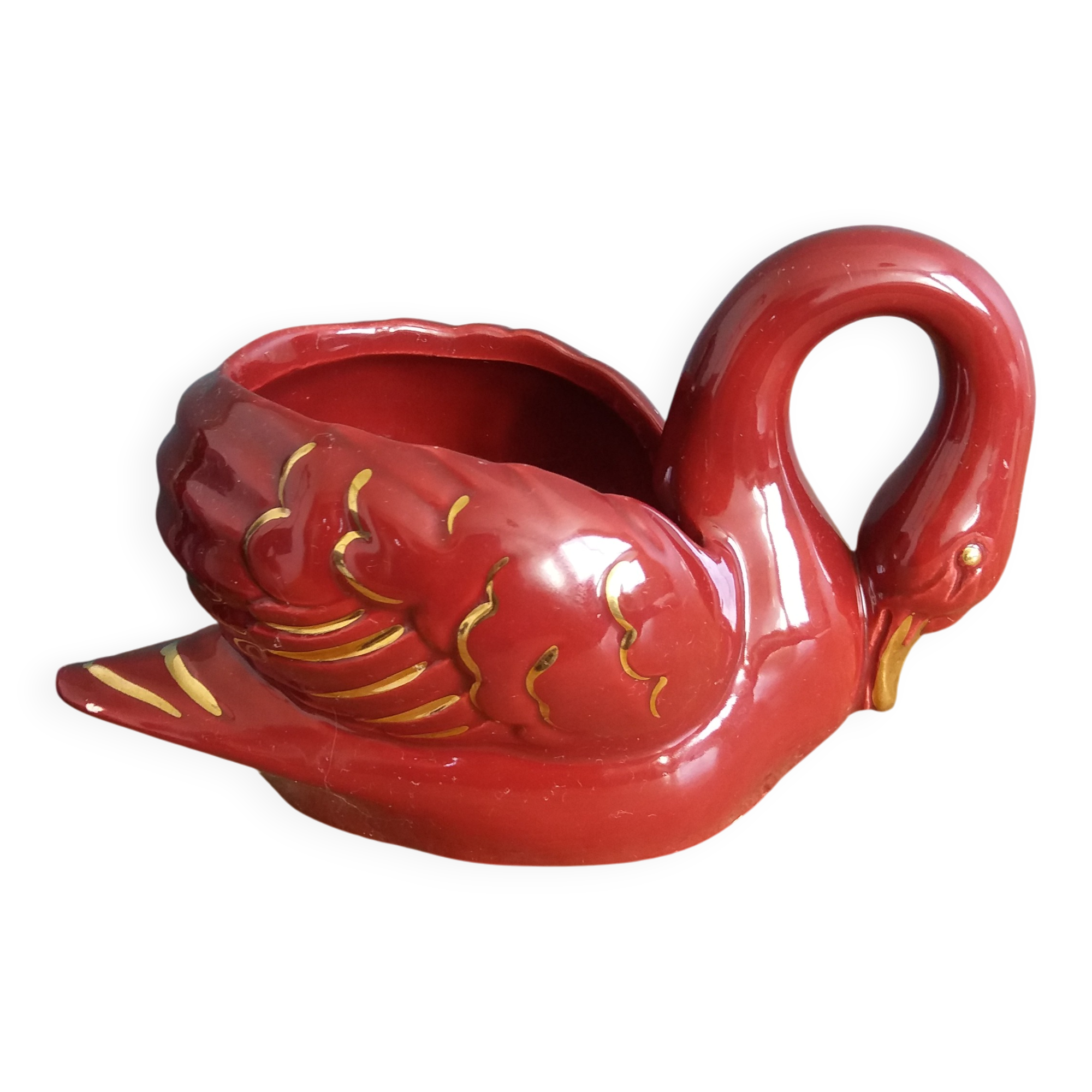 Poet Laval swan hides zoomorphic pot in burgundy ceramic.