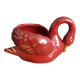 Poet Laval swan hides zoomorphic pot in burgundy ceramic.