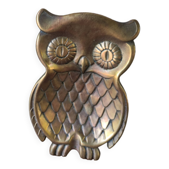 empty brass owl pocket
