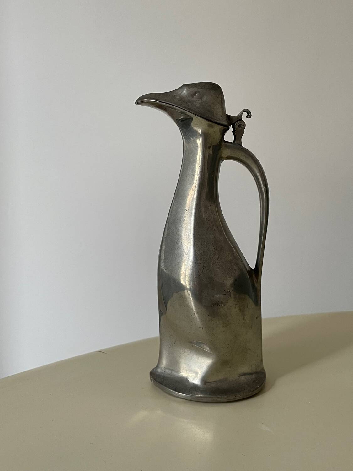 Polished pewter penguin-shaped carafe designed by Hugo Leven for Kayserzinn