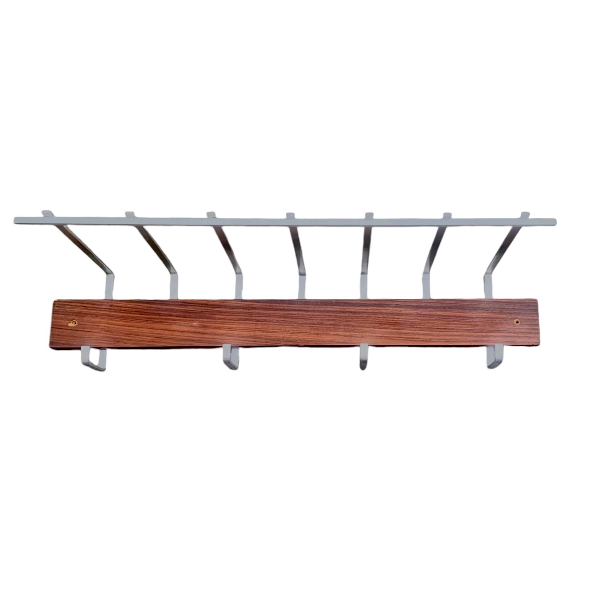 Vintage wall-mounted coat rack made of plywood and aluminum with hat rack
