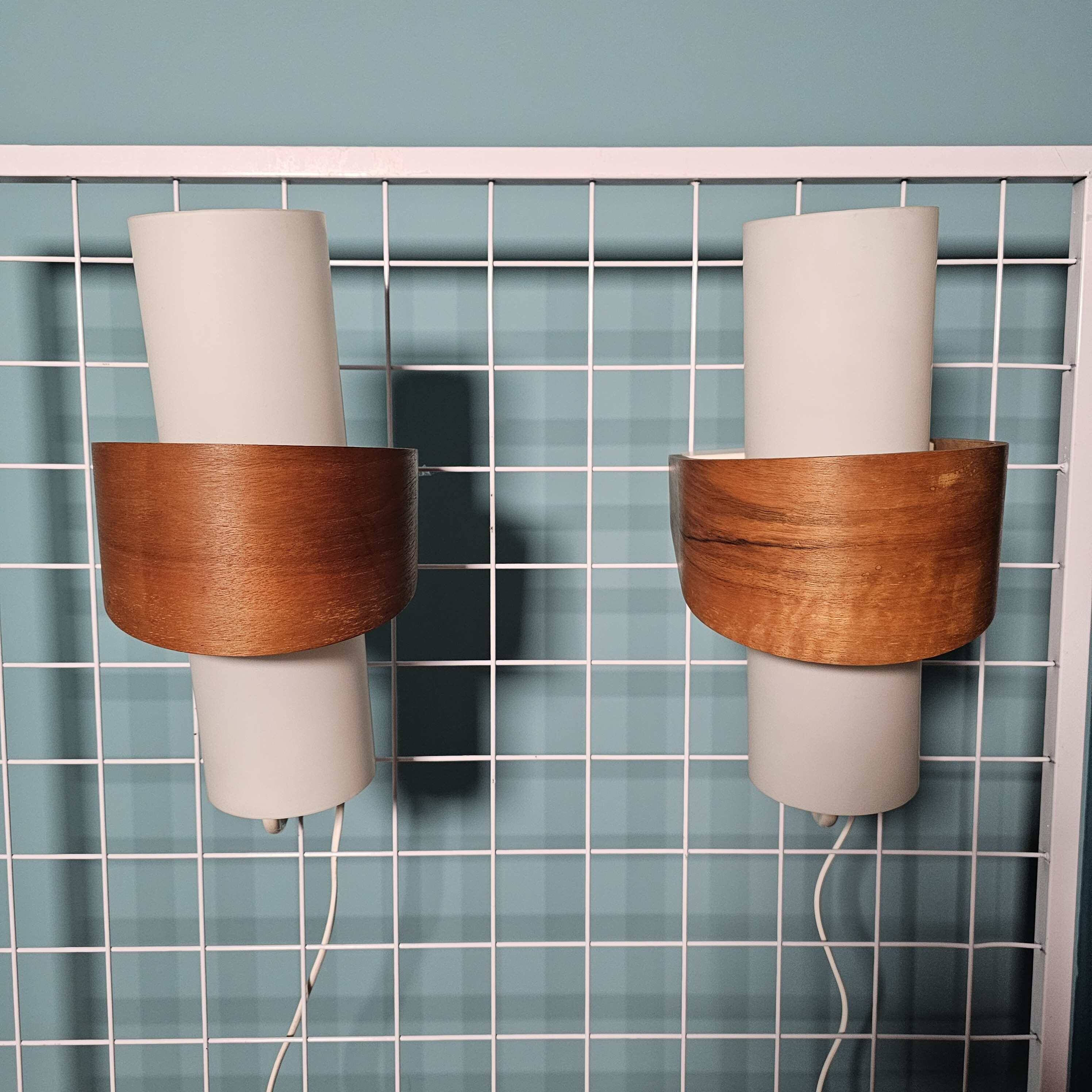 Louis kalff (1897-1976) for philips, pair of nx40 wall lights in wood, opaline glass, and lacquered metal,