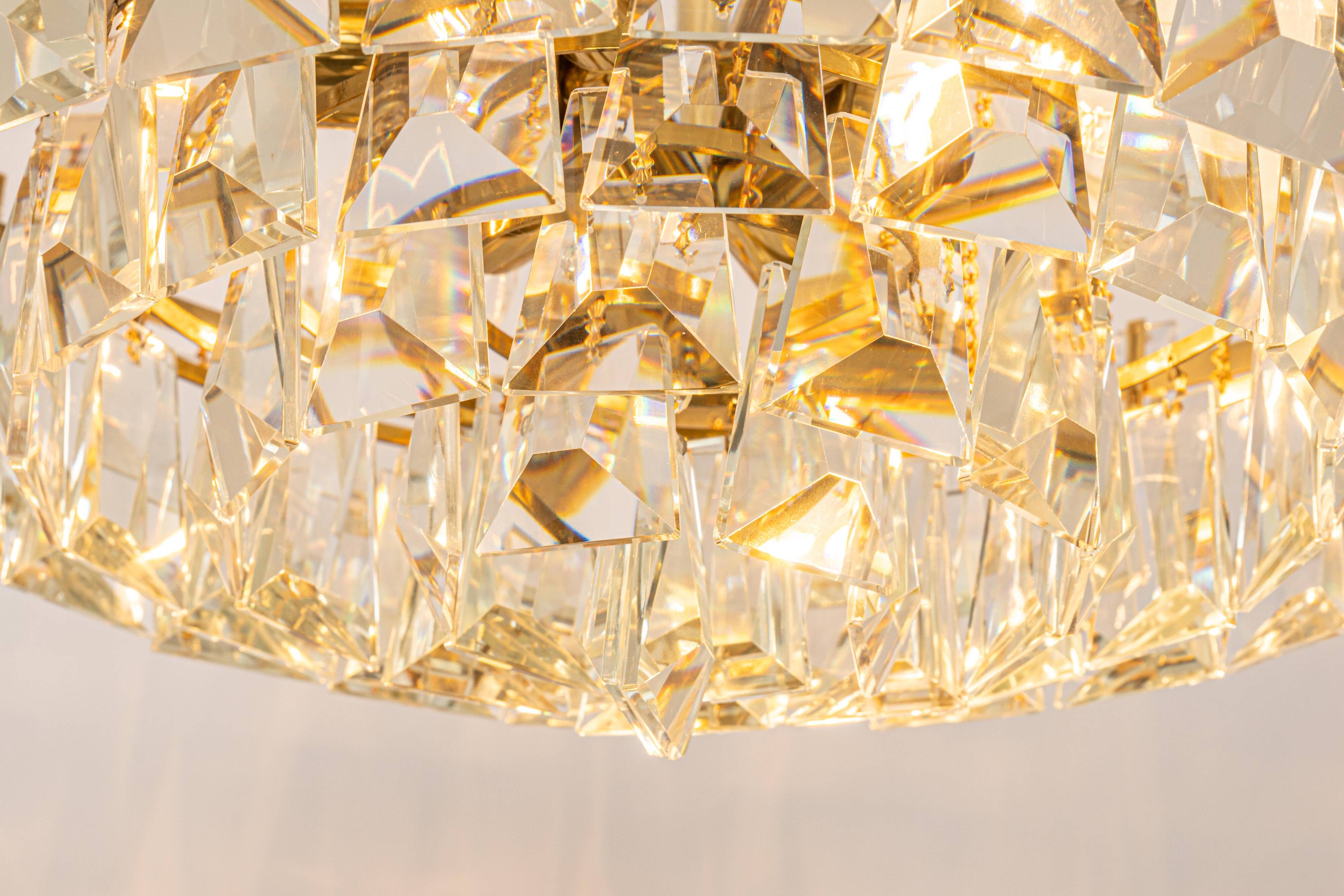 Large chandelier in gilded brass and crystal, by Palwa, Germany, 1970s.