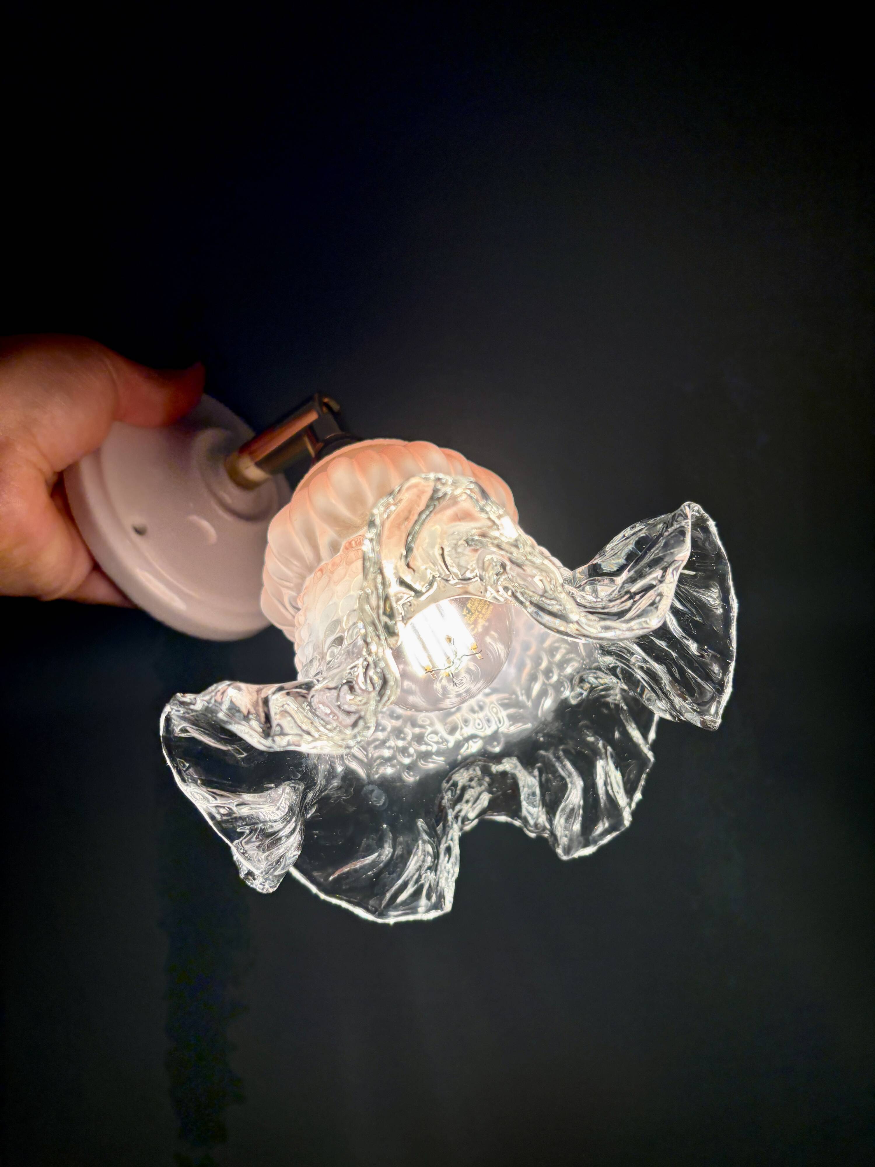 Vintage pink and clear glass tulip wall light.