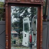 Old large carved wooden mirror