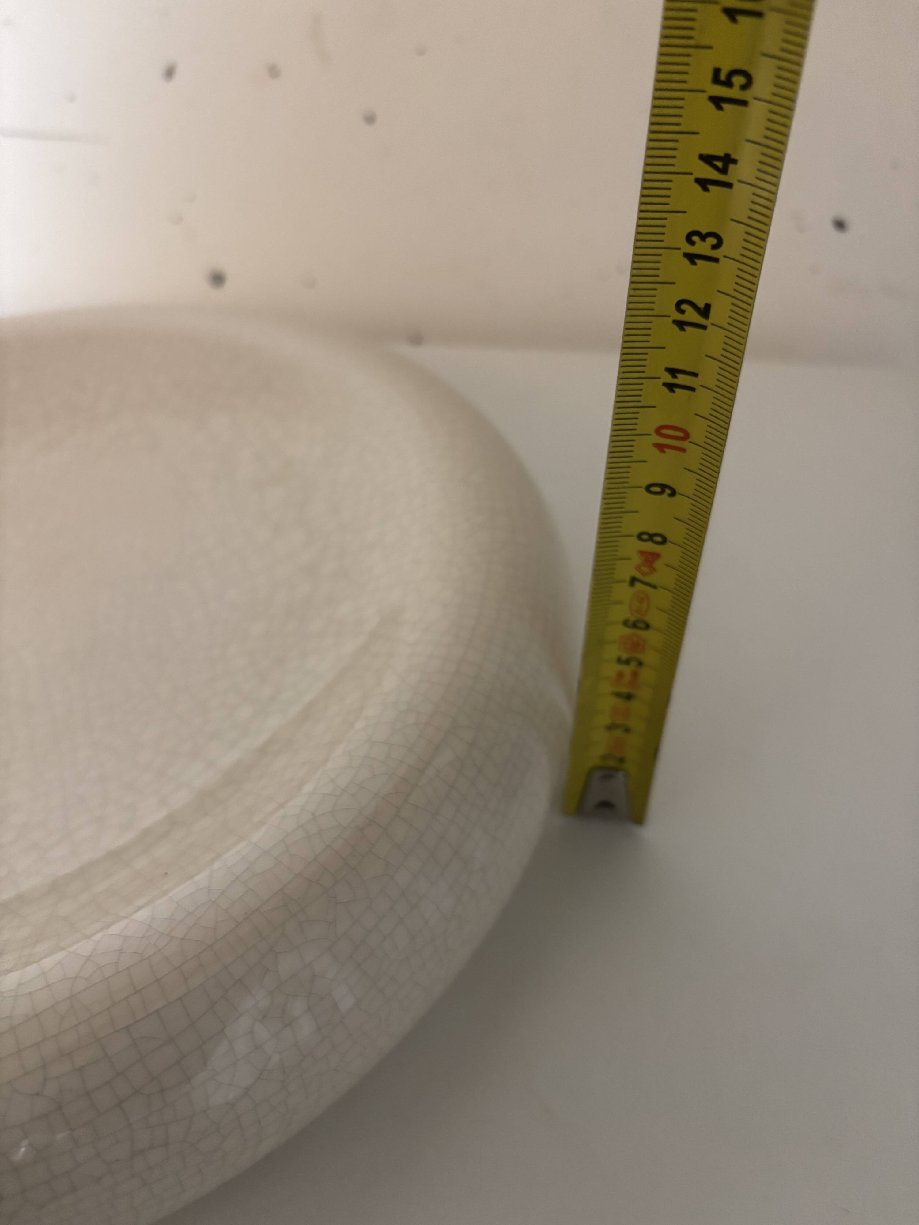 Empty pocket, cracked ceramic dish 1980