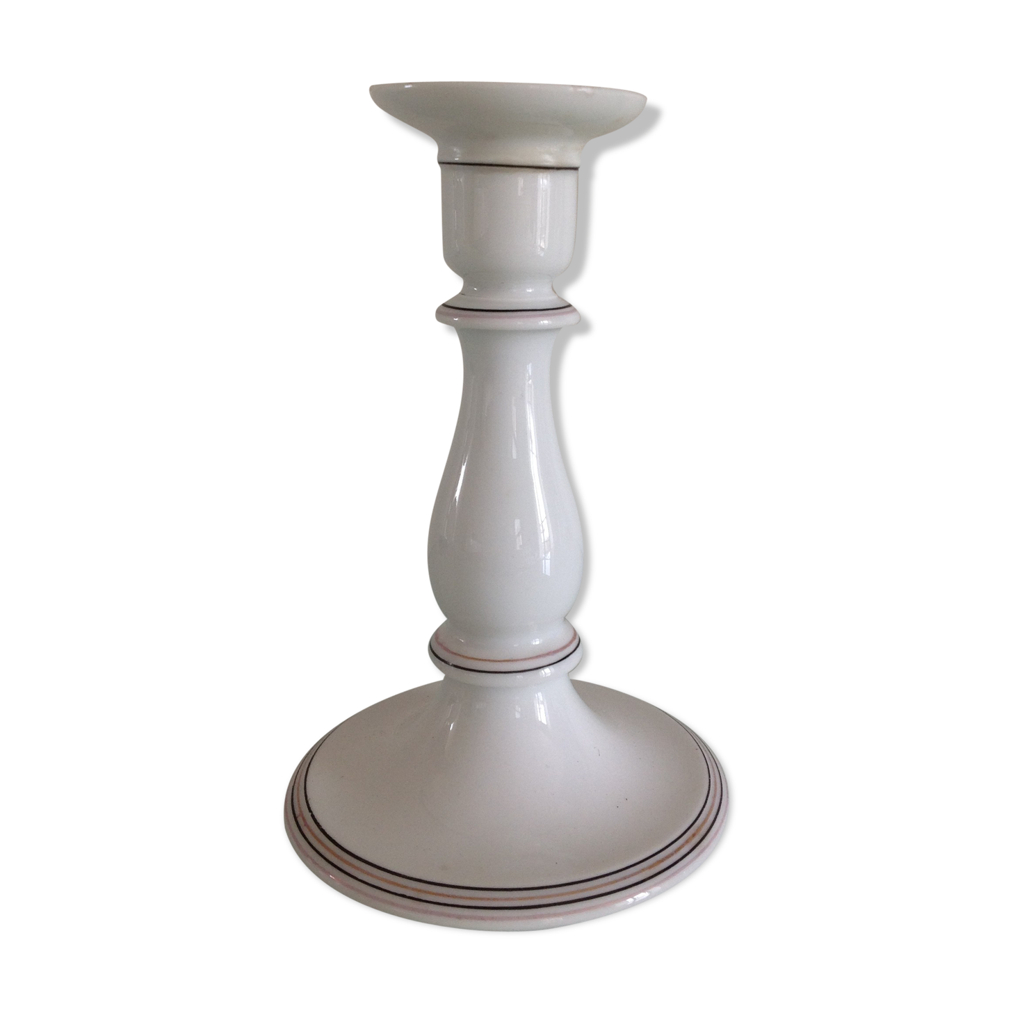 Old white earthenware candlestick