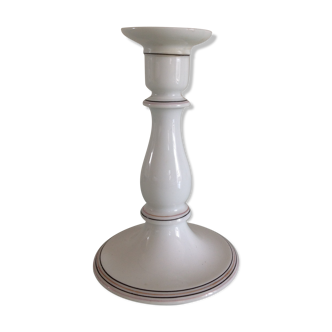 Old white earthenware candlestick