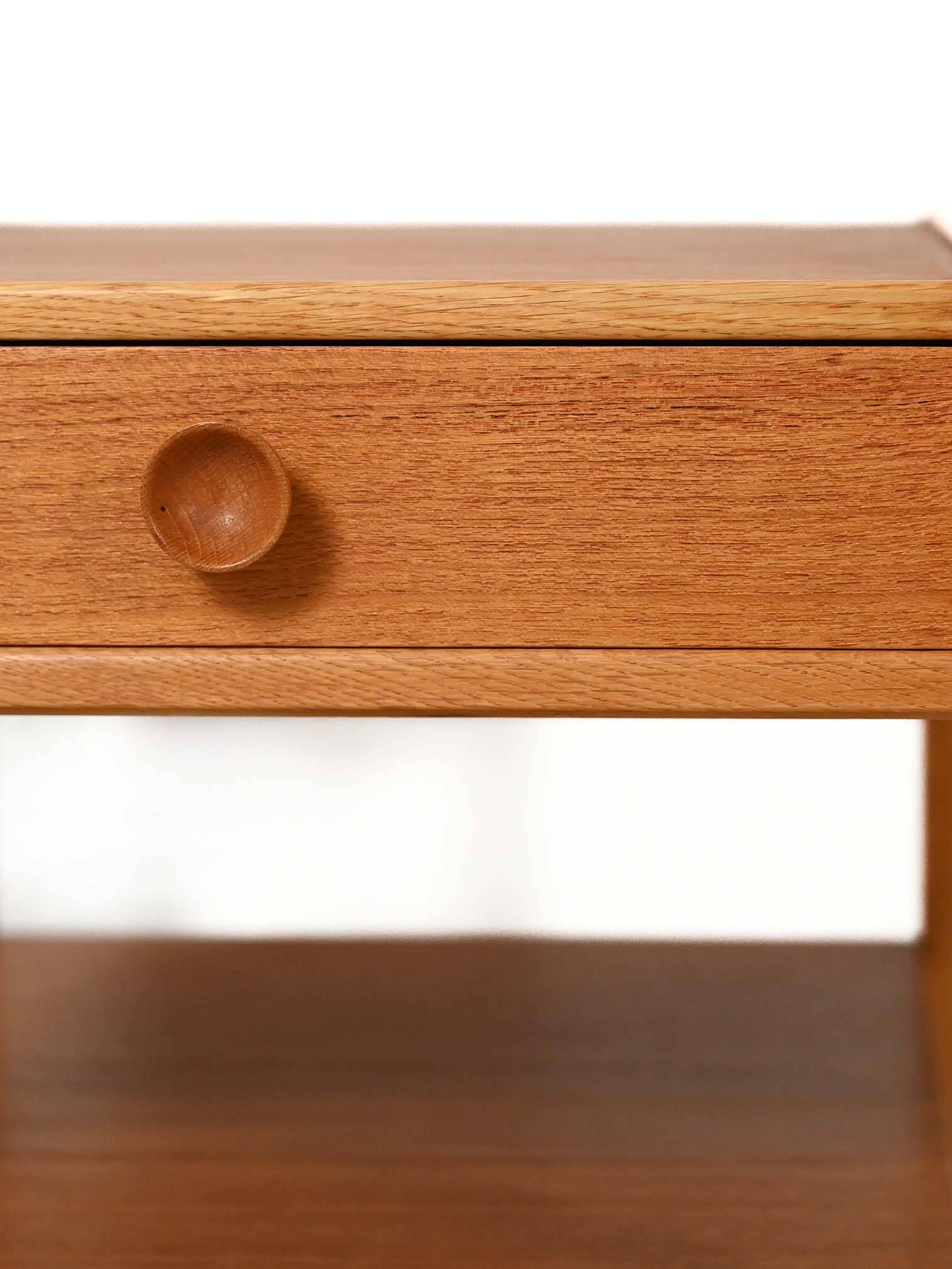 Pair of Scandinavian bedside tables from the 1950s–60s with carved handle