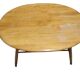 Oval wooden coffee table Ercol