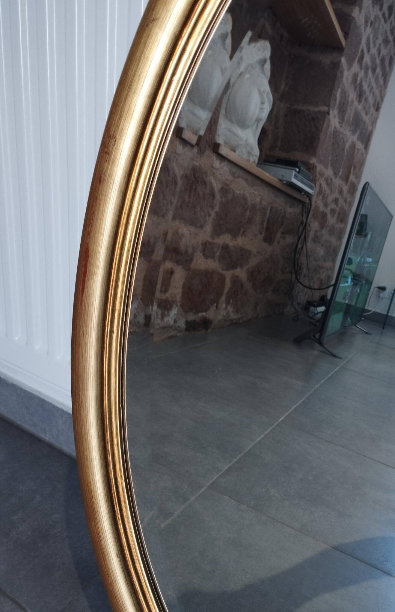 Grand et élégant miroir doré ovale avec sa glace biseauté