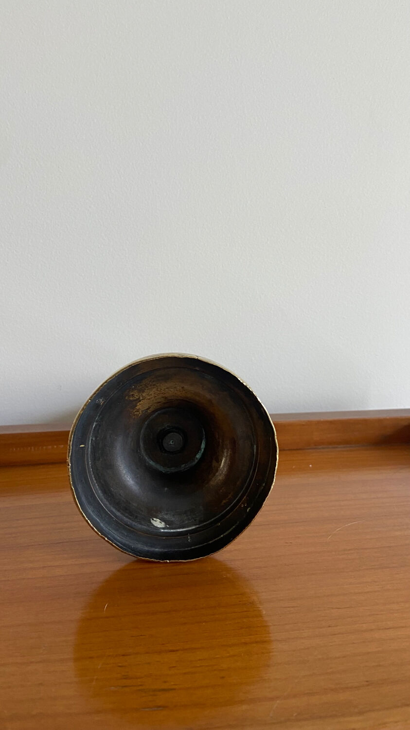 Old brass push candle holder