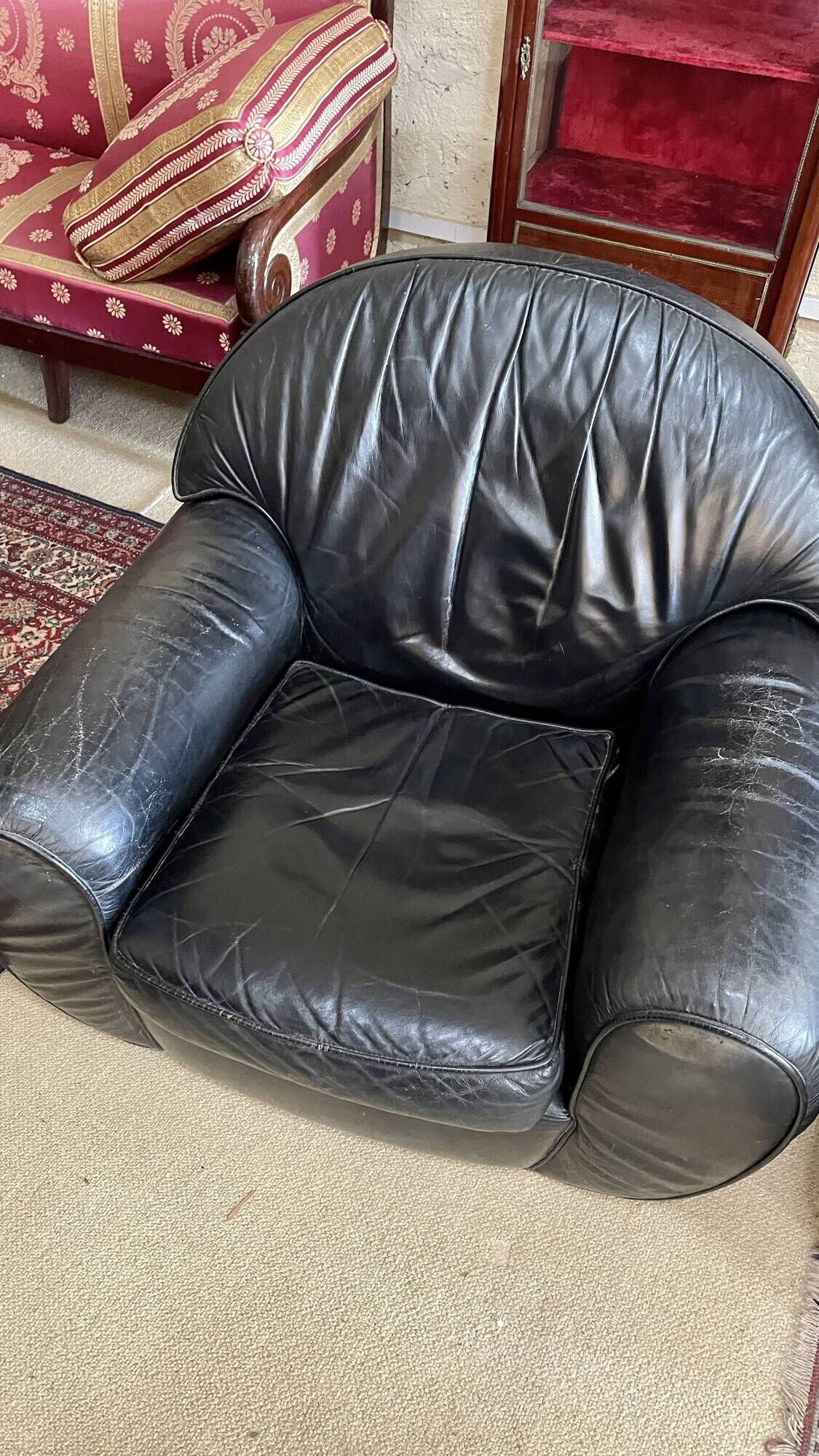Pair of black leather club armchairs, twentieth century