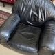 Pair of black leather club armchairs, twentieth century