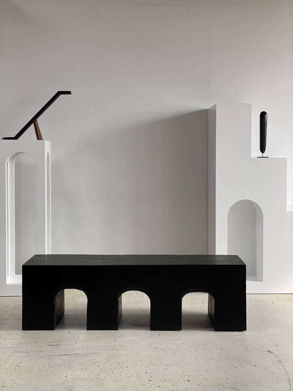 Bench in solid monoxyl wood, carved base in 3 arches - Black color