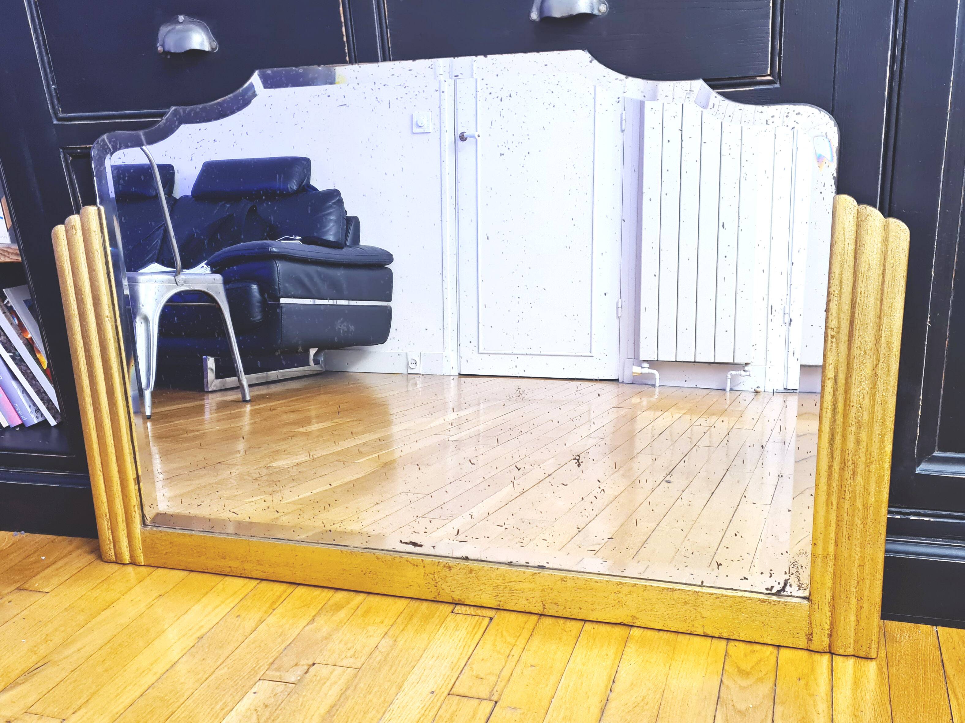 Antique large beveled mercury pediment mirror, art deco, gilded with leaf.