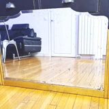 Antique large beveled mercury pediment mirror, art deco, gilded with leaf.