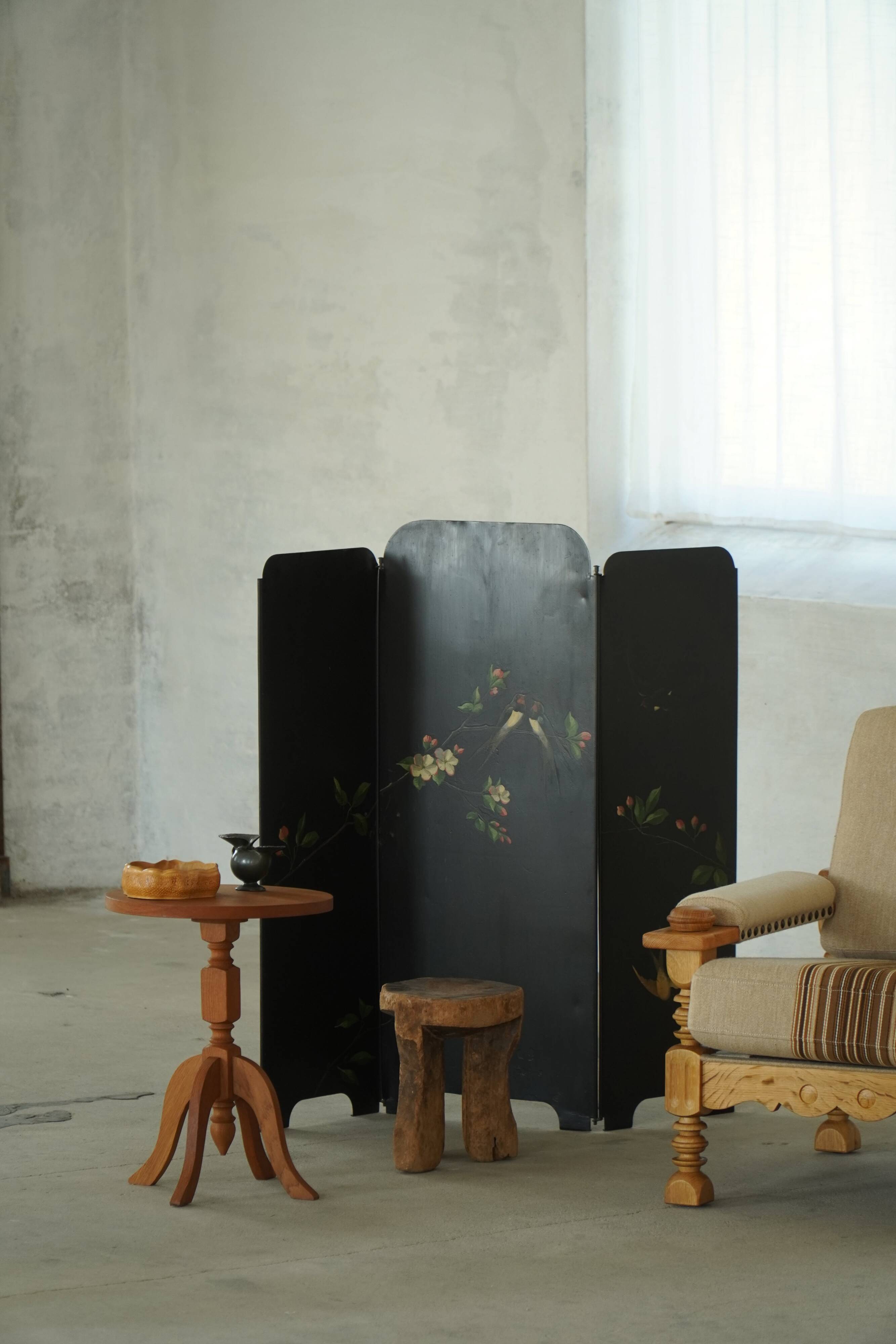 Pair of Scandinavian oak side tables with central legs and sculptural curved feet, 1960s.
