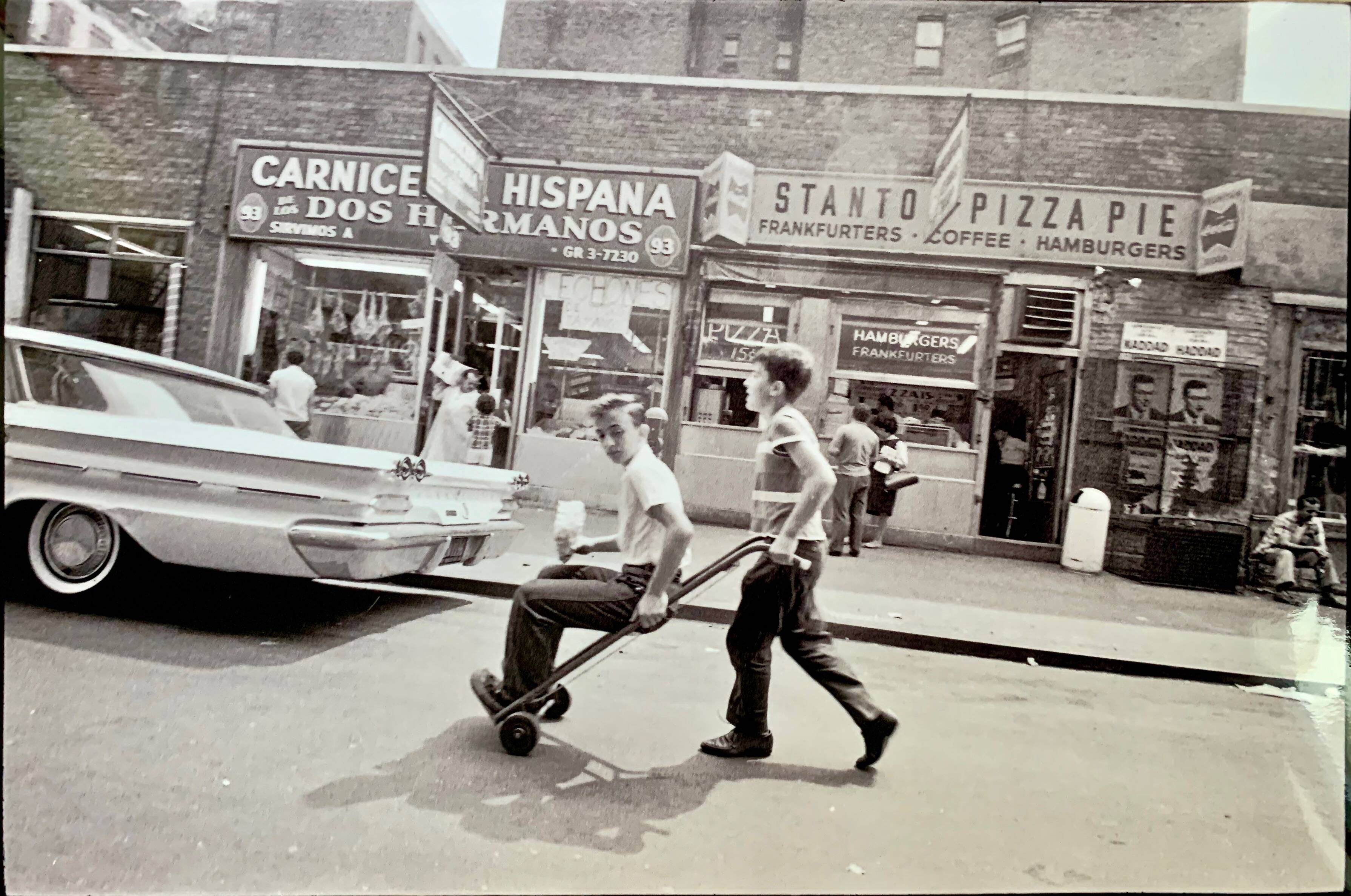 Little Italy – NYC 1964 A lively and spontaneous street scene.