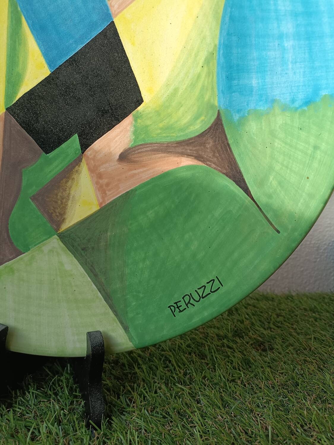 Osvaldo Perruzzi designer of polychrome faience plates.
