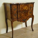 Louis XV style commode with a projection in marquetry.