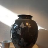 Black vase with plant decoration by Philippe Jacques