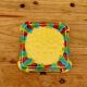 Yellow ceramic trivet and bottle coaster with vintage painted decoration.